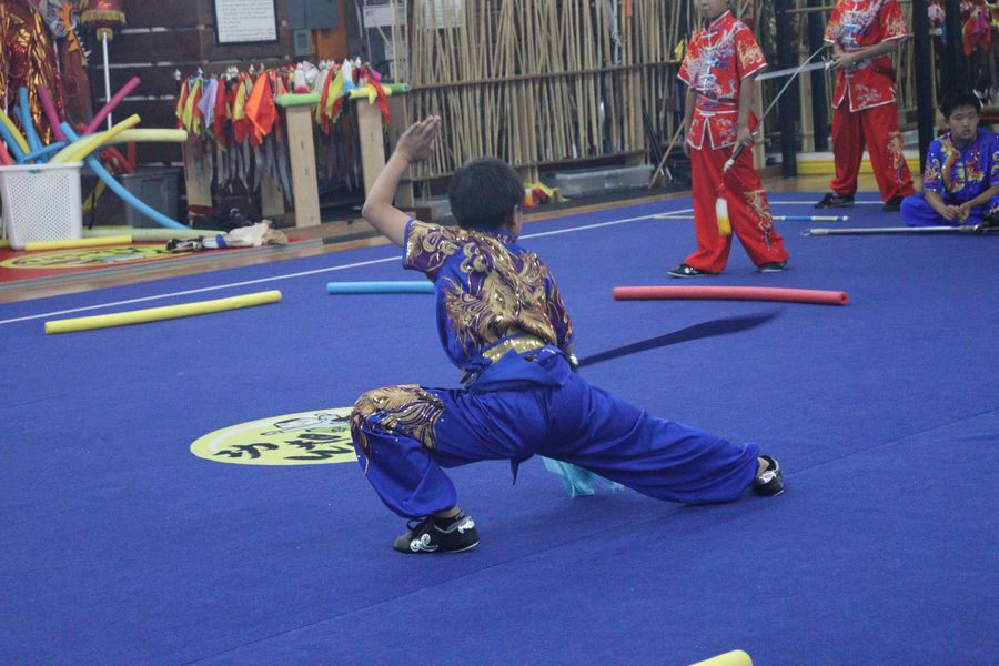 A student performing a broadsword form