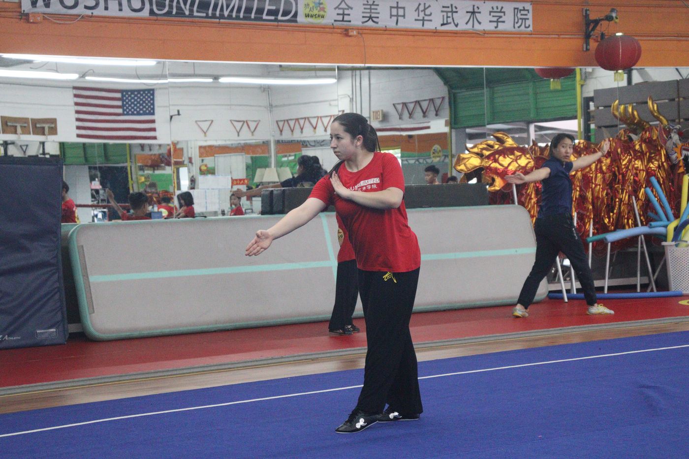 An instructor demonstrating a slow form in the training hall